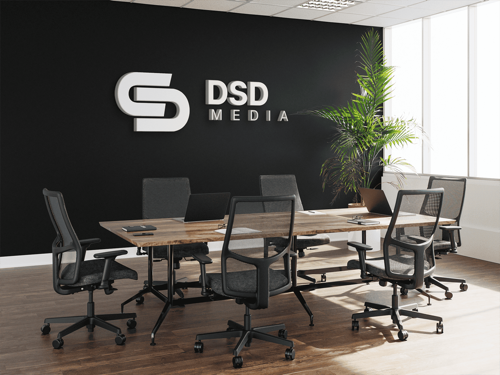 Modern office workspace showing monitors and team collaboration